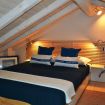 Camera da letto matrimoniale in legno con spalliera - Madonnina 1