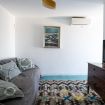 piccola zona relax con tv lcd e divano - Exclusive Villa Addaura